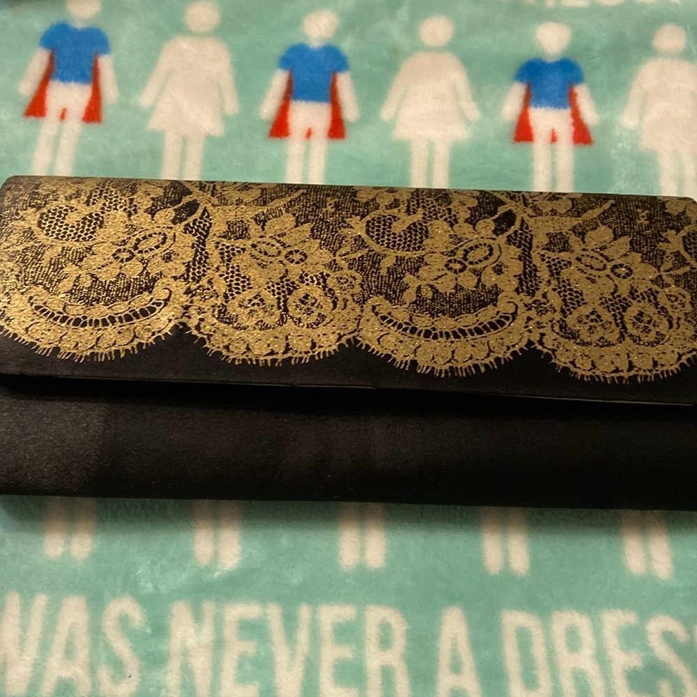 Avon black w/ gold clutch purse new